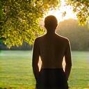 Person stretching in a peaceful outdoor setting